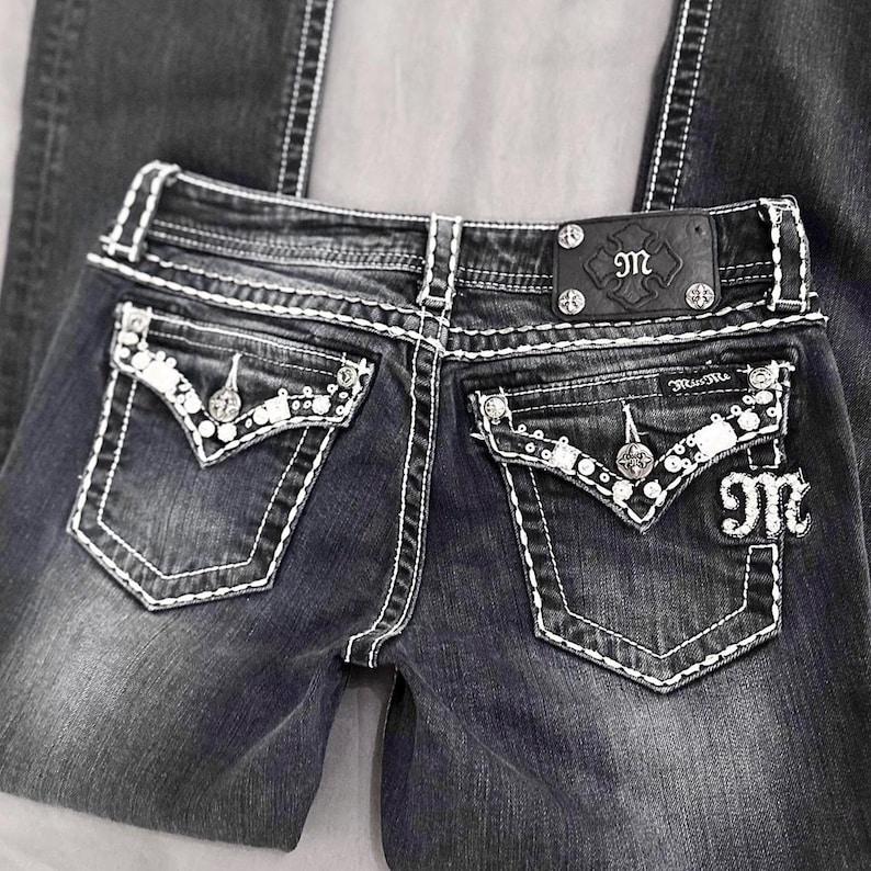 miss me? 2000’s darkwash rhinestone embellished jeans. vintage grunge ~ mcbling piece with a bootcut fit. missing a stud on the back logo